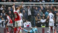 Arsenal's German midfielder #29 Kai Havertz (rear L) reacts after scoring his team third goal during the English Premier League football match between Tottenham Hotspur and Arsenal at the Tottenham Hotspur Stadium in London, on April 28, 2024. (Photo by Ben Stansall / AFP) 