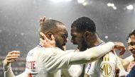 Lyon’s Clinton Mata (right) and Alexandre Lacazette celebrate a goal yesterday.
