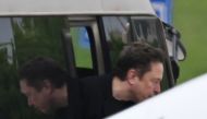 Tesla CEO Elon Musk gets off a minibus before boarding his private plane at Beijing airport on April 29, 2024. (Photo by GREG BAKER / AFP)

