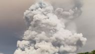 An eruption from Mount Ruang volcano is seen from Tagulandang island in Sitaro, North Sulawesi, on April 30, 2024. (Photo by AFP)