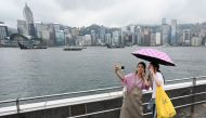 Tourists from mainland China visit the Tsim Sha Tsui waterfront in Hong Kong on May 1, 2024 at the start of the Golden Week holiday period (Photo by Peter Parks / AFP)