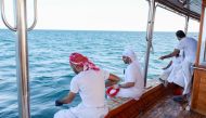 Crew of a participating dhow in action during the Senyar Festival.
