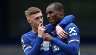 Chelsea's English midfielder #20 Cole Palmer (L) and Chelsea's Senegalese striker #15 Nicolas Jackson react following the English Premier League football match between Chelsea and West Ham United at Stamford Bridge in London on May 5, 2024. Chelsea won the match 5-0. (Photo by HENRY NICHOLLS / AFP)