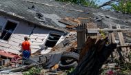 Zack Crowder views his home after it was struck by a tornado on May 07, 2024 in Barnsdall, Oklahoma. Barnsdall, a small town with a population of approximately 1,000 people, was struck last night by an EF3 tornado. (Photo by Brandon Bell / GETTY IMAGES NORTH AMERICA / Getty Images via AFP)
