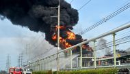 Firefighters work to extinguish a fire in a gas storage tank at the Maptaphut Industrial Port in Rayong province, eastern Thailand, on May 9, 2024. (Photo by James Wilson / Thai News Pix / AFP)
 