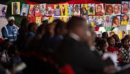 Relatives and friends attend the funeral service for the victims of a major flood and landslide that claimed dozens of lives, near the Rift Valley town of Mai Mahiu, on May 9, 2024. Photo by SIMON MAINA / AFP