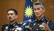 Director of the criminal investigation department of Malaysian police Mohd Shuhaily Mohd Zain (R) speaks during a press conference in Kuala Lumpur on May 8, 2024, after three Malaysian footballers were attacked in a week. Photo by Arif Kartono / AFP