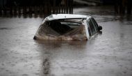 A car is seen under water at the Arquipelago neighborhood in Porto Alegre, Rio Grande do Sul state, brazil on May 12, 2024. (Photo by Anselmo CUNHA / AFP)