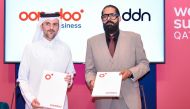 Ooredoo Qatar and DDN officials during the partnership event.