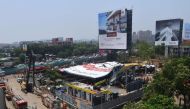 Emergency vehicles are seen parked at the site a day after an advertisement billboard collapsed over a petrol station following a storm, in Mumbai on May 14, 2024. (Photo by Imtiyaz Shaikh / AFP)