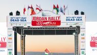 File photo of Qatar's Nasser Saleh Al Attiyah waves a flag at the start of the Jordan Rally
