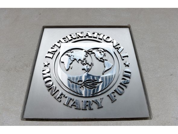 An exterior view of the building of the International Monetary Fund (IMF), with the IMG logo, is seen on March 27, 2020 in Washington, DC. AFP / Olivier DOULIERY