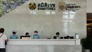 Hospital personnel work on a registration desk at Samitivej Srinakarin Hospital, where some of the injured passengers on a turbulence-hit Singapore Airlines flight were being treated, in Bangkok on May 22, 2024. Photo by MANAN VATSYAYANA / AFP