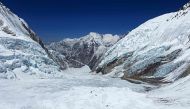 This photograph taken on May 3, 2024 shows mountaineers at the Khumbu Glacier during their ascend to Mount Everest's summit, in Nepal. Photo by Tsering Pemba Sherpa / AFP.