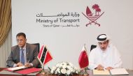 Minister of Transport H E Jassim Saif Ahmed Al Sulaiti (right) and Trinidad and Tobago’s Minister of Works and Transport H E Hon. Rohan Sinanan signing the agreement. 
