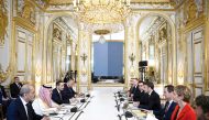 France’s President H E Emmanuel Macron attends a meeting with Prime Minister and Minister of Foreign Affairs H E Sheikh Mohammed bin Abdulrahman bin Jassim Al Thani (third left); Saudi Foreign Minister H H Prince Faisal bin Farhan Al Saud (second left); Jordanian Foreign Minister H E Ayman Safadi (first left); and Egypt Foreign Minister H E Sameh Shoukry (fourth left) for talks on the war in Gaza, at the Elysee Presidential Palace in Paris yesterday. (AFP) 