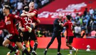 Manchester United's Dutch manager Erik ten Hag (C) celebrates with his players after winning the English FA Cup final football match between Manchester City and Manchester United at Wembley stadium, in London, on May 25, 2024. Manchester United wins 2 - 1 against Manchester City. (Photo by Ben Stansall / AFP)