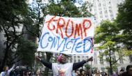 People react after former US President and Republican presidential candidate Donald Trump was convicted in his criminal trial outside of Manhattan Criminal Court in New York City, on May 30, 2024. (Photo by Kena Betancur / AFP)
