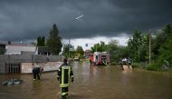 Firefighters work on a flooded street in Baar-Ebenhausen on June 2, 2024. Photo by LUKAS BARTH / AFP
