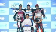 The winner of both QSTK 600 races in Round 3 of the Championship, Abdulla Al Qubaisi (centre) celebrates on the podium with Mashel Al Naimi (left) and Saeed Al Sulaiti who finished second and third respectively. 