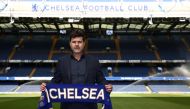 File: Chelsea's Argentinian head coach Mauricio Pochettino poses for a photograph with a Chelsea scarf beside the pitch at Stamford Bridge in London on July 7, 2023, as he is introduced to the media as the new Chelsea Head Coach. (Photo by Henry Nicholls / AFP)

