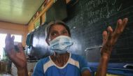 An elderly evacuee gestures as she speaks about what she saw when Mount Kanlaon volcano erupted, at an evacuation center set up at a school in a village in Canlaon, Negros Occidental province, central Philippines on June 4, 2024. Photo by Ferdinand Edralin / AFP