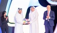Minister of Communications and Information Technology H E Mohammed bin Ali Al Mannai (right) presenting the award  to Director-General of Qatar News Agency Ahmed bin Saeed Al Rumaihi. 