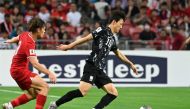 South Korea's Lee Jae-sung (R) runs with the ball during the 2026 FIFA World Cup AFC qualifiers football match between Singapore and South Korea at the National Stadium in Singapore on June 6, 2024. Photo by Roslan RAHMAN / AFP.