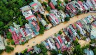 An aerial picture shows flood waters submerging buildings after heavy rain in Ha Giang city in northern Vietnam on June 10, 2024. Photo by Trong Hai / AFP