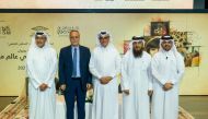 Minister of State and President of Qatar National Library H E Dr. Hamad bin Abdulaziz Al Kawari (centre) with other officials at the event.