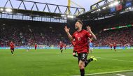 Albania's midfielder #10 Nedim Bajrami celebrates scoring his team's first goal during the UEFA Euro 2024 Group B football match between Italy and Albania at the BVB Stadion in Dortmund on June 15, 2024. (Photo by Alberto PIZZOLI / AFP)