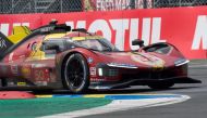 Italian driver Antonio Fuoco steers the Ferrari 499P during Le Mans 24-hours endurance race in Le Mans, western France, on June 16, 2024. (Photo by GUILLAUME SOUVANT / AFP)