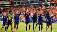 Netherlands' players celebrate after winning the UEFA Euro 2024 Group D football match between Poland and the Netherlands at the Volksparkstadion in Hamburg on June 16, 2024. (Photo by Odd ANDERSEN / AFP)