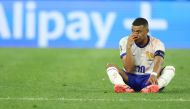 France's forward #10 Kylian Mbappe sits on the pitch after being injured during the UEFA Euro 2024 Group D football match against Austria on June 17, 2024. (Photo by Franck Fife / AFP)