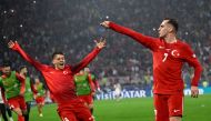 Turkiye's forward #07 Kerem Akturkoglu (R) celebrates scoring his team's third goal with Turkey's forward #08 Arda Guler during the UEFA Euro 2024 Group F football match between Turkey and Georgia at the BVB Stadion in Dortmund on June 18, 2024. (Photo by INA FASSBENDER / AFP)


