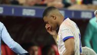 France's forward #10 Kylian Mbappe leaves the pitch after being injured during the UEFA Euro 2024 Group D football match between Austria and France at the Duesseldorf Arena in Duesseldorf on June 17, 2024. Photo by FRANCK FIFE / AFP.