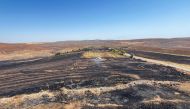 This handout photograph taken and released on June 21, 2024 by Turkish news agency DHA (Demiroren News Agency) shows a burnt field after a wildfitre swept overnight through two areas between the districts of Diyarbakir and Mardin in southeastern Turkey. Photo by Handout / DHA (Demiroren News Agency) / AFP.