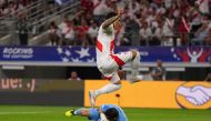 Paolo Guerrero of Peru jumps over Claudio Bravo of Chile as he saves the ball during the CONMEBOL Copa America 2024 Group A match between Peru and Chile at AT&T Stadium on June 21, 2024 in Arlington, Texas. (Photo by Sam Hodde / GETTY IMAGES NORTH AMERICA / Getty Images via AFP)
