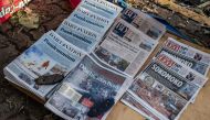 Newspapers are seen displayed on the floor of a small newspaper stall following a deadly nationwide strike to protest against tax hikes and the Finance Bill 2024 in downtown Nairobi, on June 26, 2024. (Photo by Luis Tato / AFP)