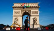 Workers install the Agitos, the symbol of the Paralympic Games on the Arc de Triomphe ahead of the upcoming Paris 2024 Olympic Games and Paralympic Games in Paris on June 28, 2024. (Photo by Dimitar Dilkoff / AFP)
