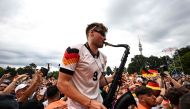 German saxophonist Andre Schnura performs for Germany supporters on June 29, 2024. (Photo by Patricia De Melo Moreira / AFP)