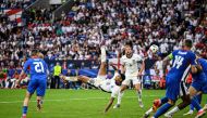 England's midfielder #10 Jude Bellingham shoots an overhead kick to score his team's first goal during the UEFA Euro 2024 round of 16 football match between England and Slovakia at the Arena AufSchalke in Gelsenkirchen on June 30, 2024. (Photo by INA FASSBENDER / AFP)
