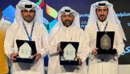 Qatar Media Corporation officials with the awards.