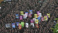Members of the National Samsung Electronics Union stage a rally as they begin a three-day general strike outside the company's foundry and semiconductor factory in Hwaseong on July 8, 2024. (Photo by Jung Yeon-je / AFP)