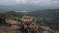 (Armed Forces of the DRC) soldier stands at a frontline military position above the town of Kibirizi, controlled by the M23 rebellion, North Kivu province, eastern Democratic Republic of Congo, on May 14, 2024.  (Photo by ALEXIS HUGUET / AFP)
