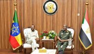 The President of Sudan's Transitional Sovereignty Council (TSC) General Abdel Fattah al-Burhan (R) meets with Ethiopia's Prime Minister Abiy Ahmed during an official visit in Port Sudan on July 9, 2024. (Photo by AFP)
