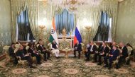 In this pool photograph distributed by the Russian state agency Sputnik, Russia's President Vladimir Putin meets with Indian Prime Minister Narendra Modi at the Kremlin in Moscow on July 9, 2024. (Photo by Sergei Karpukhin / POOL / AFP)