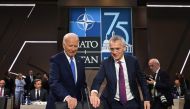 US President Joe Biden (left) and NATO Secretary-General Jens Stoltenberg take their seats at a meeting of the NATO-Ukraine Council during the NATO 75th anniversary summit at the Walter E. Washington Convention Center in Washington, DC, on July 11, 2024. (Photo by Saul Loeb / AFP)