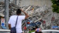 Rescuers work at the site of collapsed scaffolding in the Malley suburb of Lausanne on July 12, 2024. (Photo by Fabrice COFFRINI / AFP)
