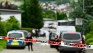 Policemen tape off the site of a crime in Albstadt-Lautlingen near Reutlingen, southern Germany, on July 14, 2024. (Photo by Silas Stein / AFP)
